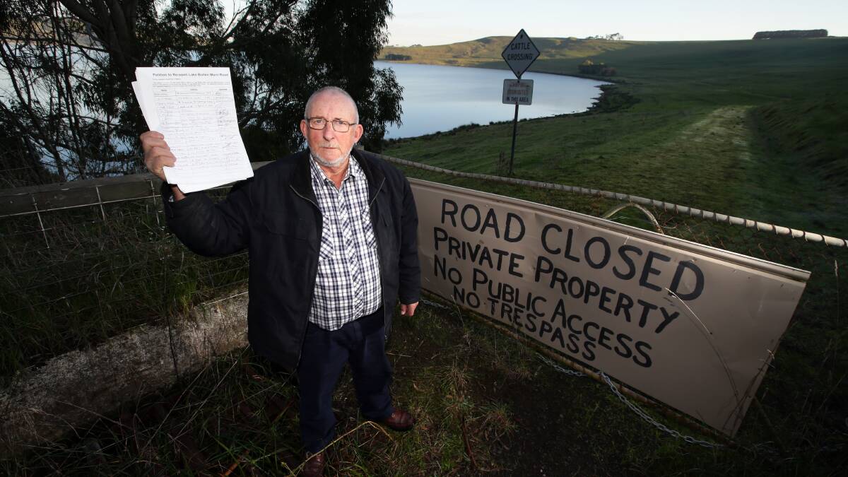 Camperdown Angling Club president John Royal holds a petition to reopen the access road around Lake Bullen Merri. 140722DW06 Picture: DAMIAN WHITE