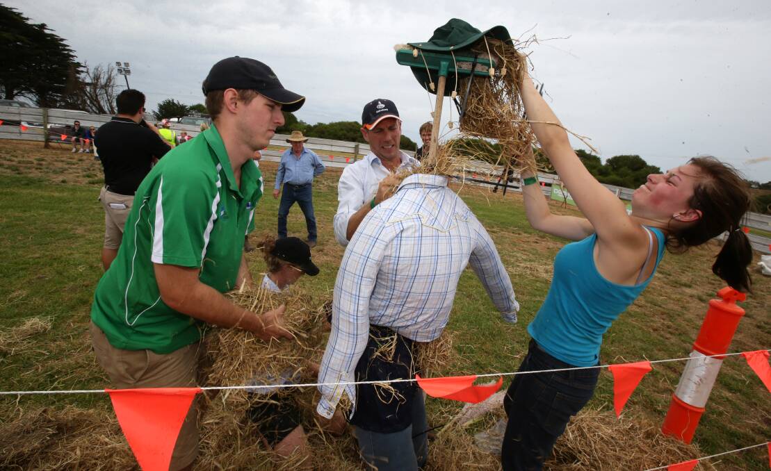 Matt Reynolds (left), Andrea Fahey, Rob Swinton and Zita Ritchie from the winning Farmer Challenge team Crouching Cow, Hidden Tractor, make a scarecrow.