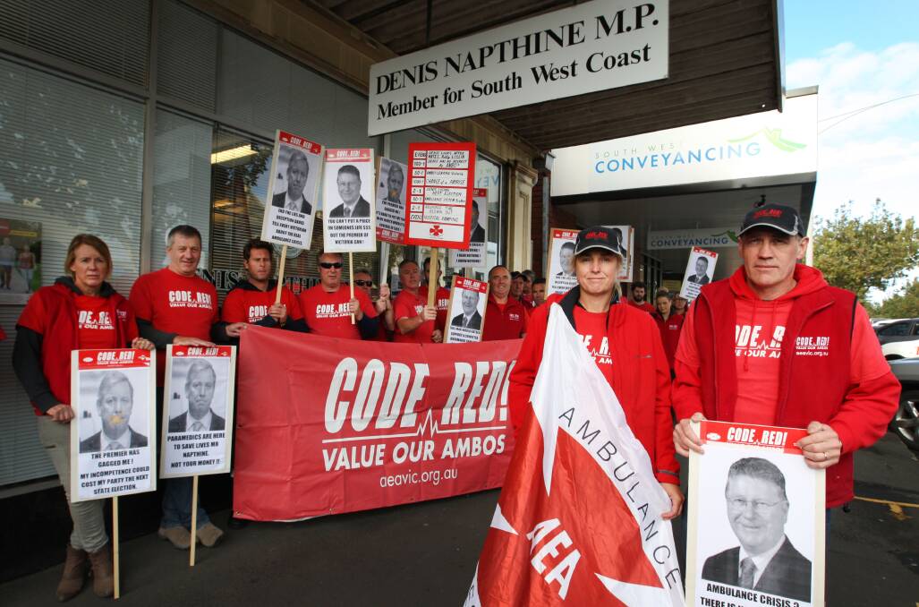 Seeking resolution of a long-running pay parity impasse, paramedics Debra Baumgartner (front left) and Jock O’Connor lead a picket of Denis Napthine’s office. 
