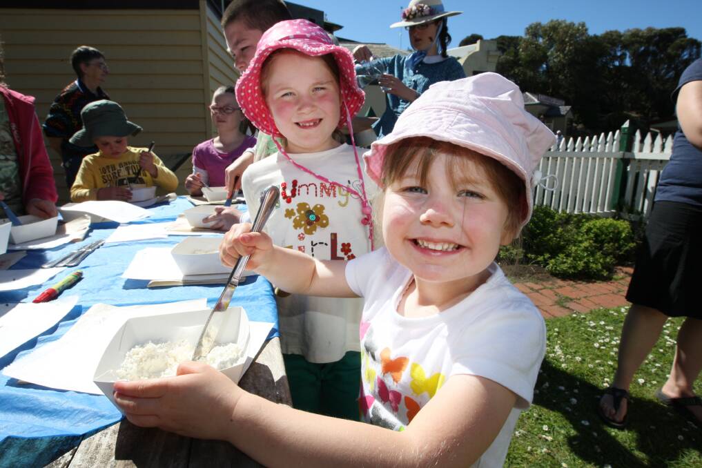 Sisters Scarlet, 6, and Mae Roberts, 4, of Warrnambool, prepare a pizza at yesterday’s kids’ cooking class at Flagstaff Hill.   
 140922AM17   Picture: ANGELA MILNE