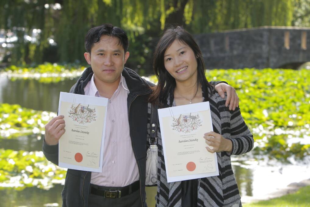 Minh Toan Nguyen (left) and Thi My Hanh Tran display their Australian Citizenship certificates.    150126AM07 Picture: ANGELA MILNE