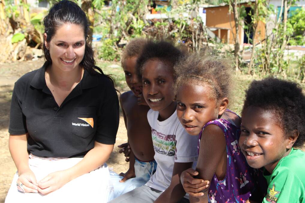 Former Derrinallum woman Chloe Morrison with local children at Ohlen Nampanga in Vanuatu. Picture: WORLD VISION