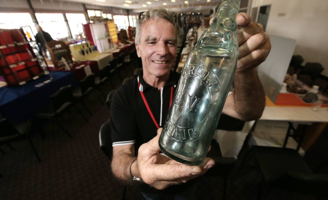 Ron Cashmore, from Port Fairy, shows off his award-winning J Virgona Codd bottle (26oz) from the 1920s, at the South West Bottle and Collectable Club show.