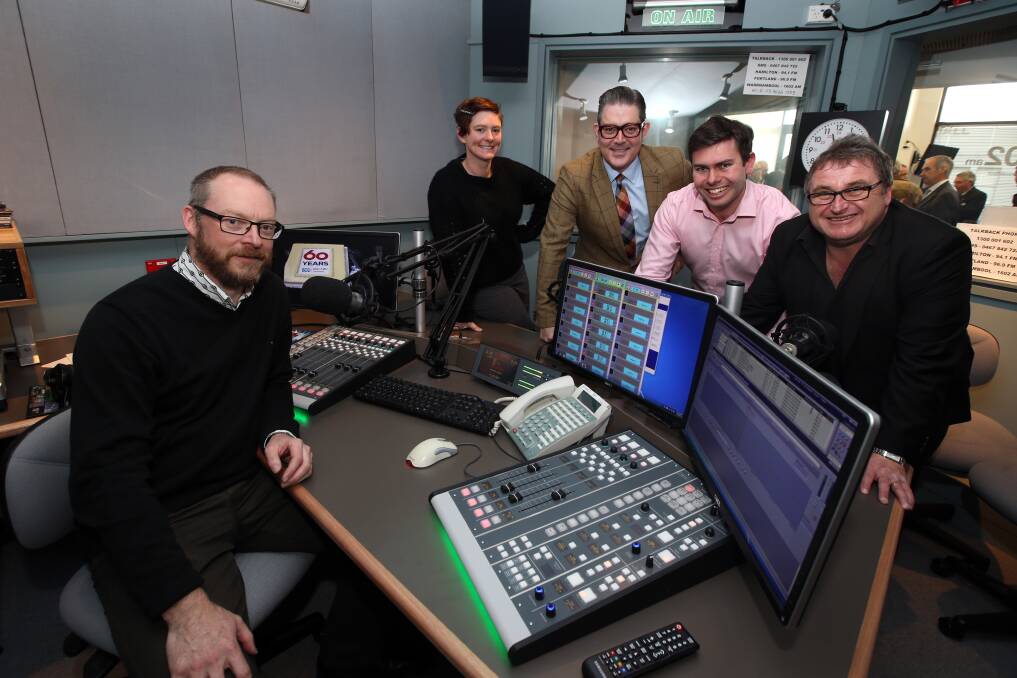 Warrnambool ABC Radio presenter Jeremy Lee (left) with community producer Emily Bissland, director of ABC Victoria Randal Mathieson, news journalist Dan Conifer and manager of Ballarat and south-west Victoria Dominic Brine in the expanded studio and newsroom. 140807DW01 Picture: DAMIAN WHITE