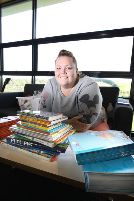 Third-year Deakin University student teacher Vanessa Knight is preparing for a work experience stint in Vanuatu — taking as many books for her pupils as possible.    140609AM25 Picture: ANGELA MILNE