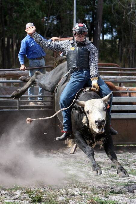 Chris Young from Western Australia rides a young bull in practice at Woodall’s property at Lyons, near Dartmoor, before last year’s Dartmoor Rodeo.