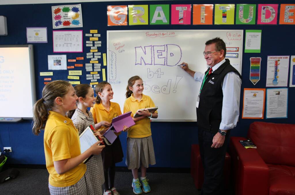 Warrnambool Primary School pupils Halle Bilson (left), Ruby Lenehan, Akira Earnshaw and Eliza McLachlan, all 10, have joined NED b4 bed — no electronic devices for 30 minutes before retiring, earning a big tick from principal Peter Auchettl. 150423LP07 Picture: LEANNE PICKETT