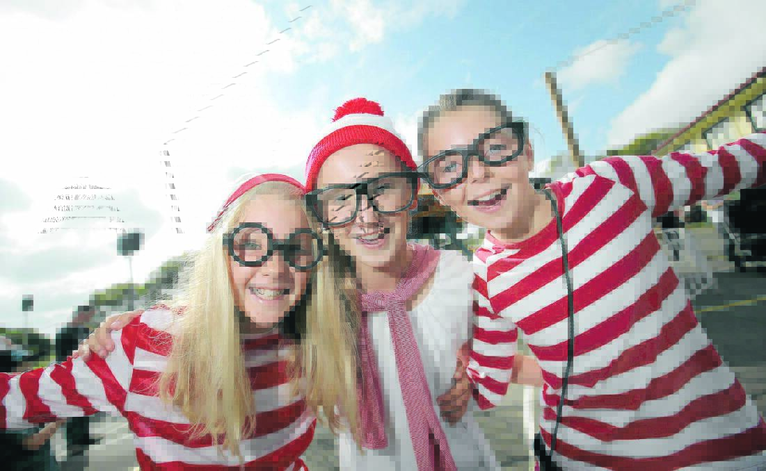 Annelli Cook, 11, (left), Sophie Quinlan, 11, and Molly O’Brien, 11, all from Warrnambool, enjoyed acting like Wallies for a day.