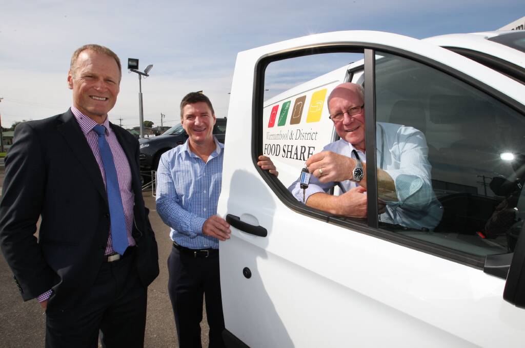 Warrnambool Lattes Cycling Group representative Shane Wilson (left), and Norton Ford dealer principal Marcus Norton hand over the new van to Warrnambool and District Food Share executive officer Dedy Friebe.140416LP16 Picture: LEANNE PICKETT