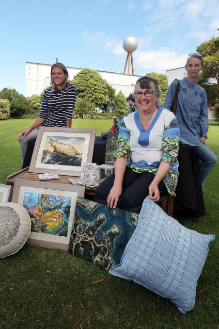 Warrnambool artists Caroline Healey (left), Rachel Peters and Danielle O’Brien with their artworks, which will be on offer at the FJs Christmas garden party. 141211RG16 Picture: ROB GUNSTONE