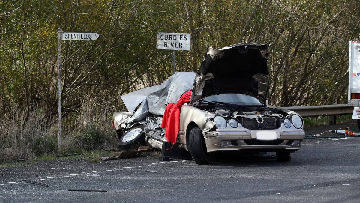 The crash victim's Mercedes sedan was extensively damaged.