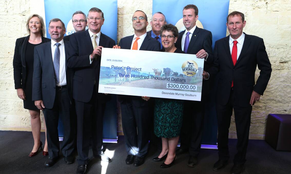 Premier Denis Napthine, Devondale Murray Goulburn managing director Gary Helou, Peter’s Project appeal chairman Vicki Jellie, federal member for Wannon Dan Tehan and board members of Devondale Murray Goulburn display the company’s $300,000 donation.