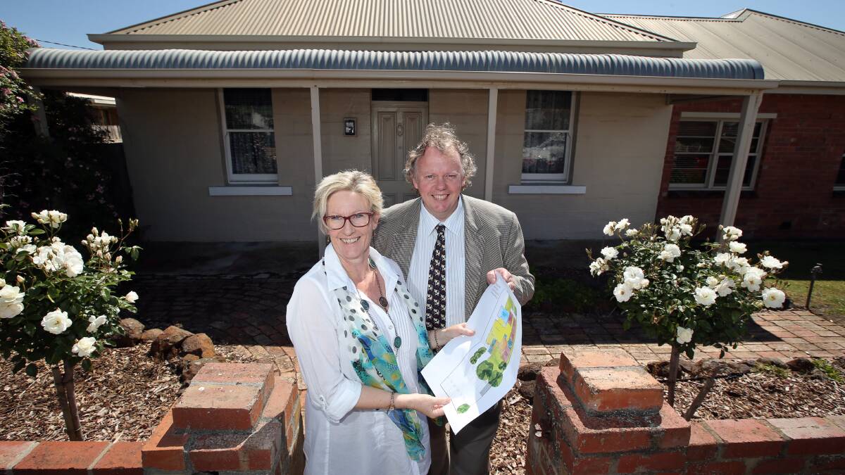 Mpower CEO Kerry Nelson (left) and president David Beggs with plans for the new respite and therapy centre. 141107DW13 Picture: DAMIAN WHITE