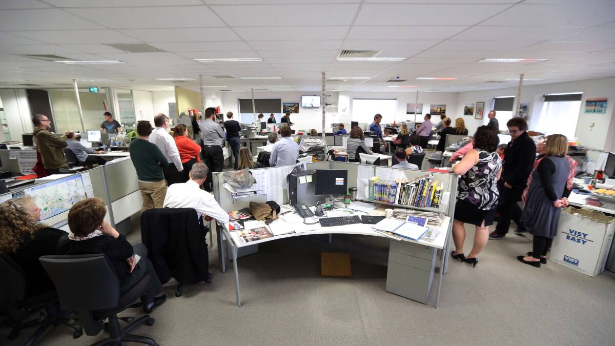 Staff gather in The Standard’s newsroom yesterday to hear Fairfax’s announcement of its final restructure plan for its regional newspapers — including the loss of 15 jobs at Warrnambool.                                       150416LP80 Picture: Damian White