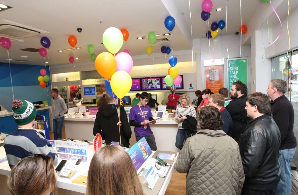 Prospective customers line up in the Telstra store on Koroit Street in Warrnambool after its 8am opening — the earliest having arrived three hours earlier. 140919AM02 Picture: ANGELA MILNE
