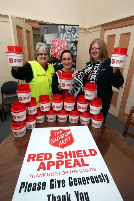 The Salvation Army Red Shield Appeal volunteers Valerie Morgan (left), Tanya Tampion and Sally Stephenson prepare for this month’s big fund-raiser. 140507DW01 Picture: DAMIAN WHITE
