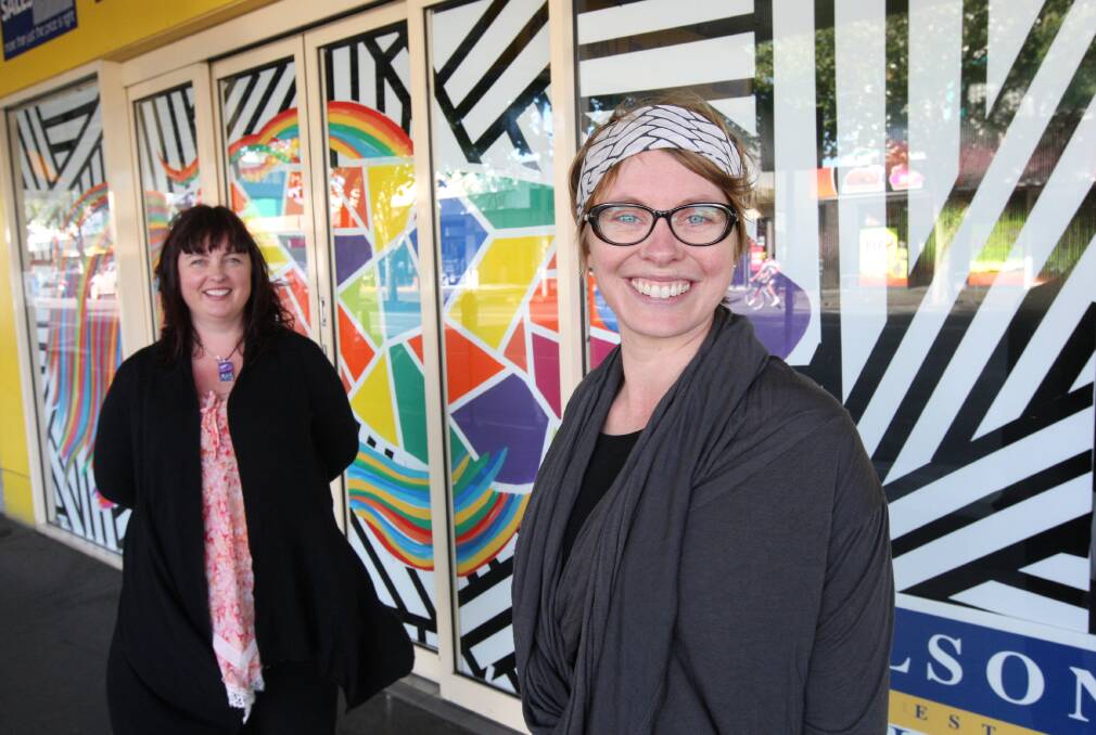 Artists Liz Gannon and Ella Webb have created the first window art work for a project aiming to brighten up empty shops in Warrnambool’s CBD. 141209AS41 Picture: AARON SAWALL