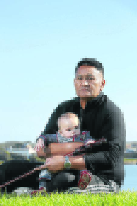 James Tioro, holding his son Zavier, four months, lives in Perth — but the court ruling means his partner and her two part-Aboriginal sons can not join him. 
140508DW30 Picture: DAMIAN WHITE