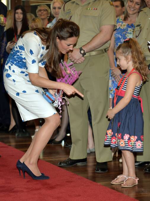  Catherine, Duchess of Cambridge meets Tahila McCabe as the Duke and Duchess of Cambridge visit RAAF base Amberley on April 19, 2014 in Brisbane, Australia. The Duke and Duchess of Cambridge are on a three-week tour of Australia and New Zealand, the first official trip overseas with their son, Prince George of Cambridge. Photo: Anthony Devlin - Pool/Getty Images.