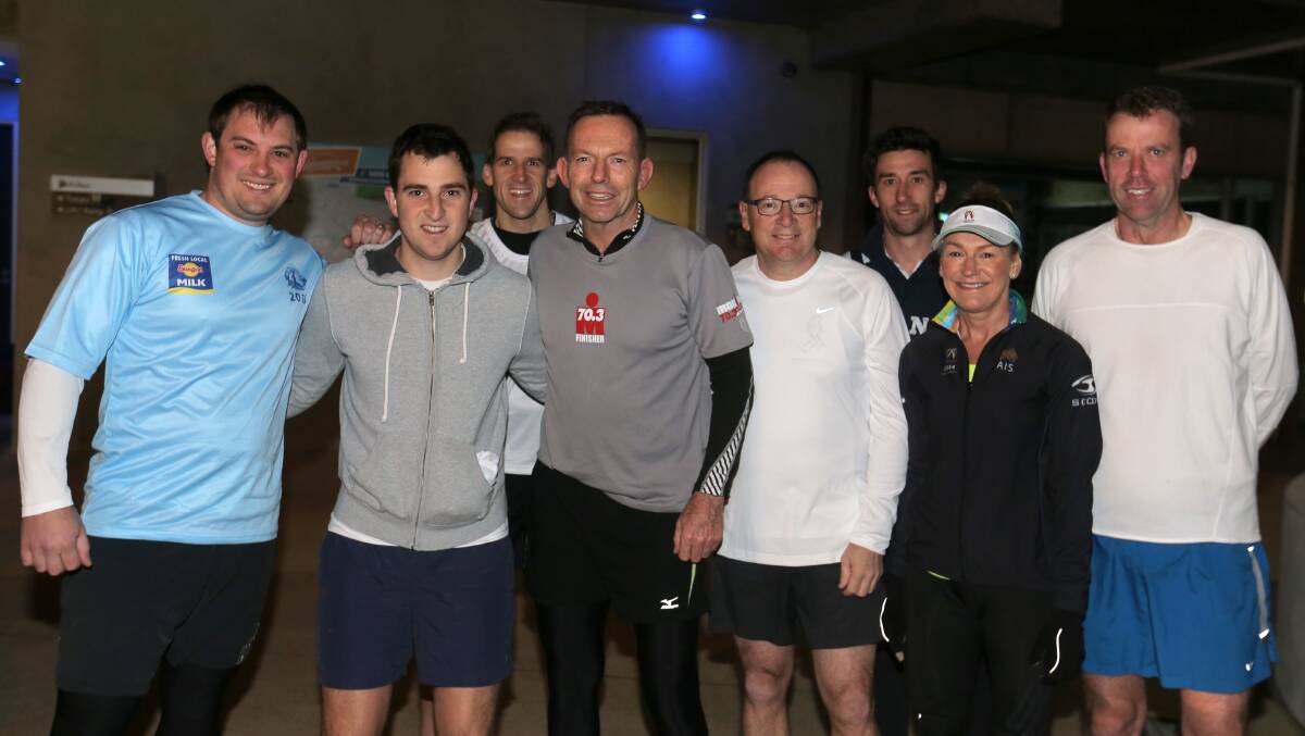 Prime Minister Tony Abbott (centre) with organisers of Warrnambool's Surf'T'Surf fun run, and local MP Dan Tehan (right), before setting off for a training run in Warrnambool. Picture: ROB GUNSTONE