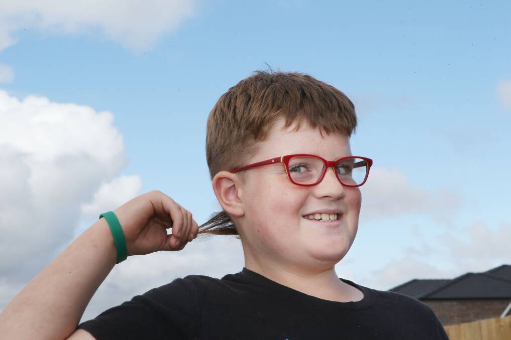 Toby Fish, 8, of Warrnambool, will give his carefully cultivated “rat tail” hairstyle the chop on Good Friday to raise money for Royal Children’s Hospital.      150327AM41 Picture: ANGELA MILNE
