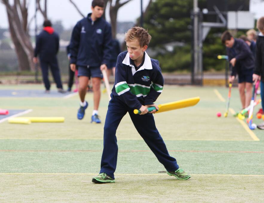 Warrnambool College student Luke Wilson demonstrates his technique with the cricket bat.  Pictures: ANGELA MILNE