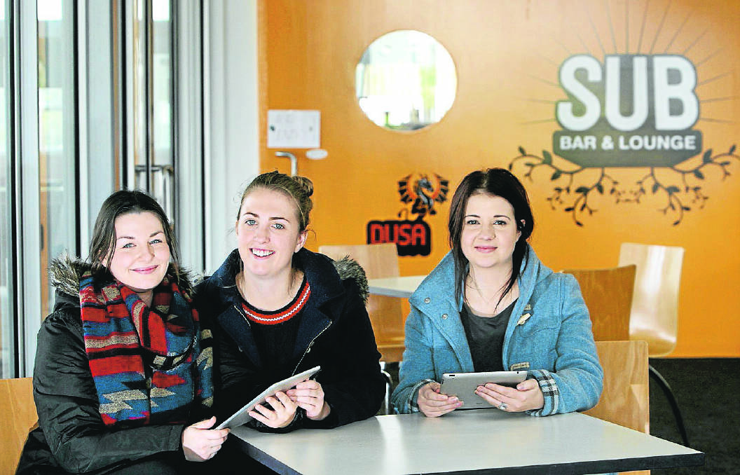 Teaching students Emma Rowley, 23 (left), Georgina Hay, 22, and Narelle Lucas, 23, can now submit their assignments online after Deakin’s transition to a paperless office.  140801LP20 Picture: LEANNE PICKETT
