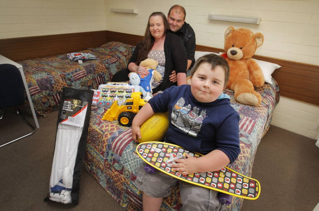 A family was forced to sell some of their Christmas presents to pay for accommodation in Warrnambool but the community has rallied and donated new toys for the kids and found them a house to live.Pictured Parents Jarna Brill and father Tyler McCulloch and son Connor McCulloch,4, at the Downtown Motel.        141222AM27   Picture: ANGELA MILNE