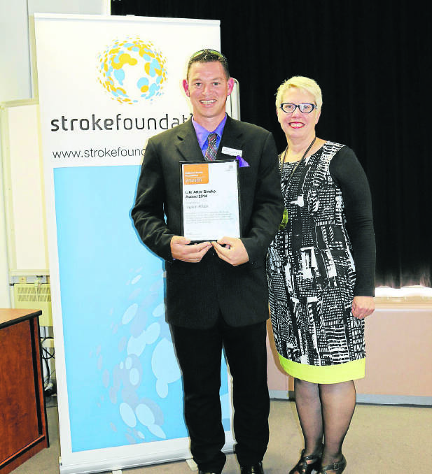 Jayson Killick shows off his award with Rebecca Naylor from the National Stroke Foundation. Picture: Supplied
