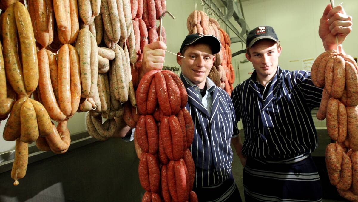 Meat Barn manager and butcher Glenn Claridge (left) holds gold-medal winning black Angus sausages while butcher sausage maker Corey MacDonald shows the Italian pork sausages which also won gold.