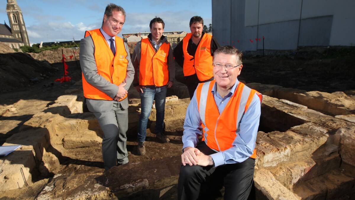 The DEPI’s Peter Beston (left), archaeological consultant Jarrod MacCulloch, BDH director Michael Hawkes and Premier Denis Napthine with the historical foundations uncovered on a Warrnambool construction site.