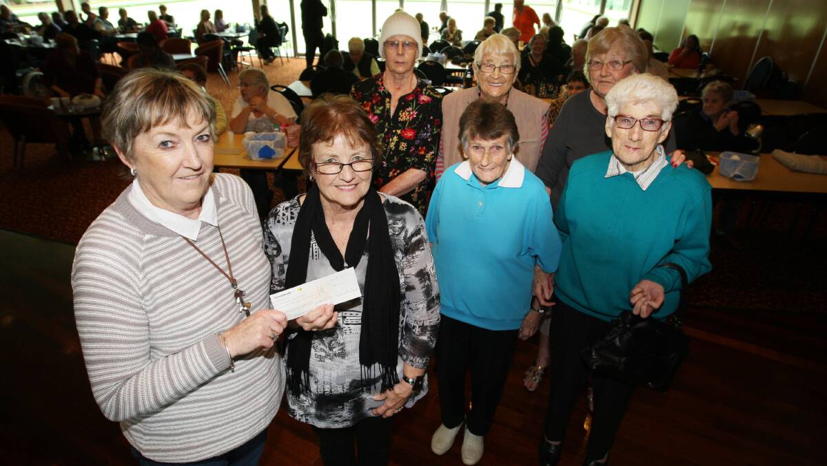 Breast cancer survivors Pauline Burleigh (left) and Judi Doherty hold the latest $10,000 cheque presented to South West Healthcare — taking to $50,000 the amount raised since starting the Lucky7 Cancer Bingo initiative four years ago. With them are fellow bingo supporters Cath Brown (back, left), Edna Johnson, Mary Anderson, Marie Flynn and Sylvia Daffy.   