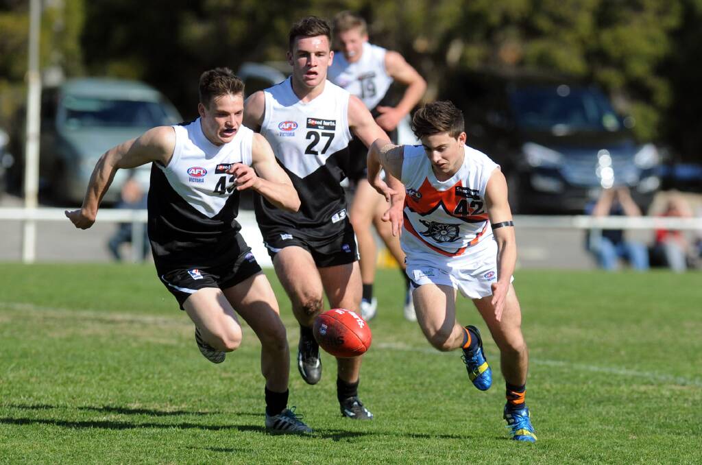 Rebels players James Gow and Thomas Ludeman chase Joshua Cauchi of the Cannons during yesterday’s clash at Horsham.  Picture: WIMMERA MAIL TIMES