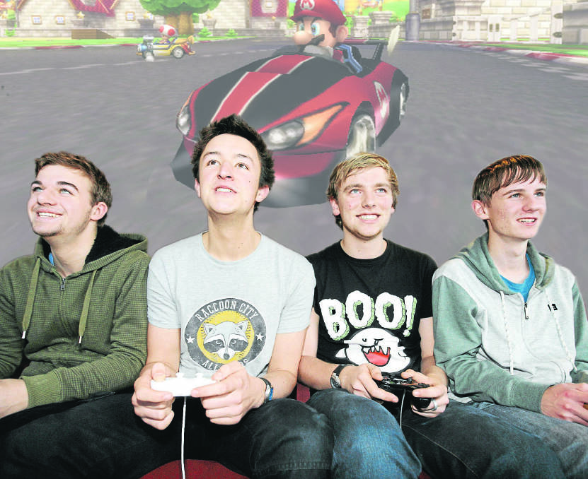 Brauer College students (from left) James Hickman, Josh Alexander, Harry Twyford and Matt Smith set a new world record for playing Mario Kart in one session — 35 hours and 46 minutes. 
140705AM40 Picture: ANGELA MILNE