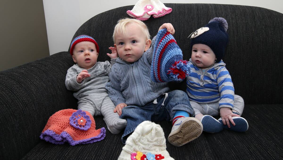 Mini models Finbar Smith, 18 weeks, Peter Fry, 15 months, and James Peck, 19 weeks, promote a beanie fund-raiser for Warrnambool’s breastfeeding centre. 
