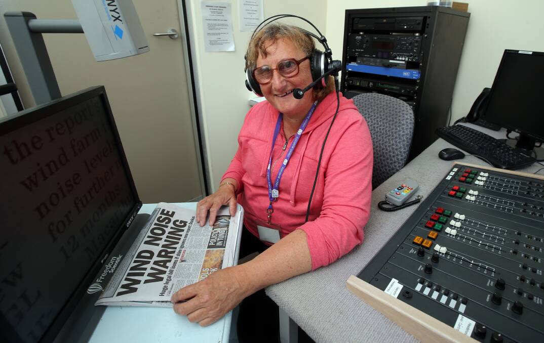 Vision Australia news reader Rose Egerton gets familiar with the new headset this week. 141124DW46 Picture: DAMIAN WHITE