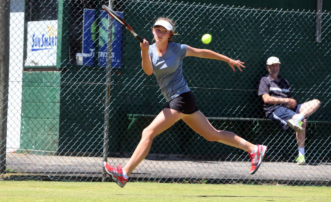 Geelong entrant Mia Dementiev covers the baseline on the stretch to power a forehand shot during a singles qualifying game. She was eliminated but gets a second chance in the consolation quarter-finals today.