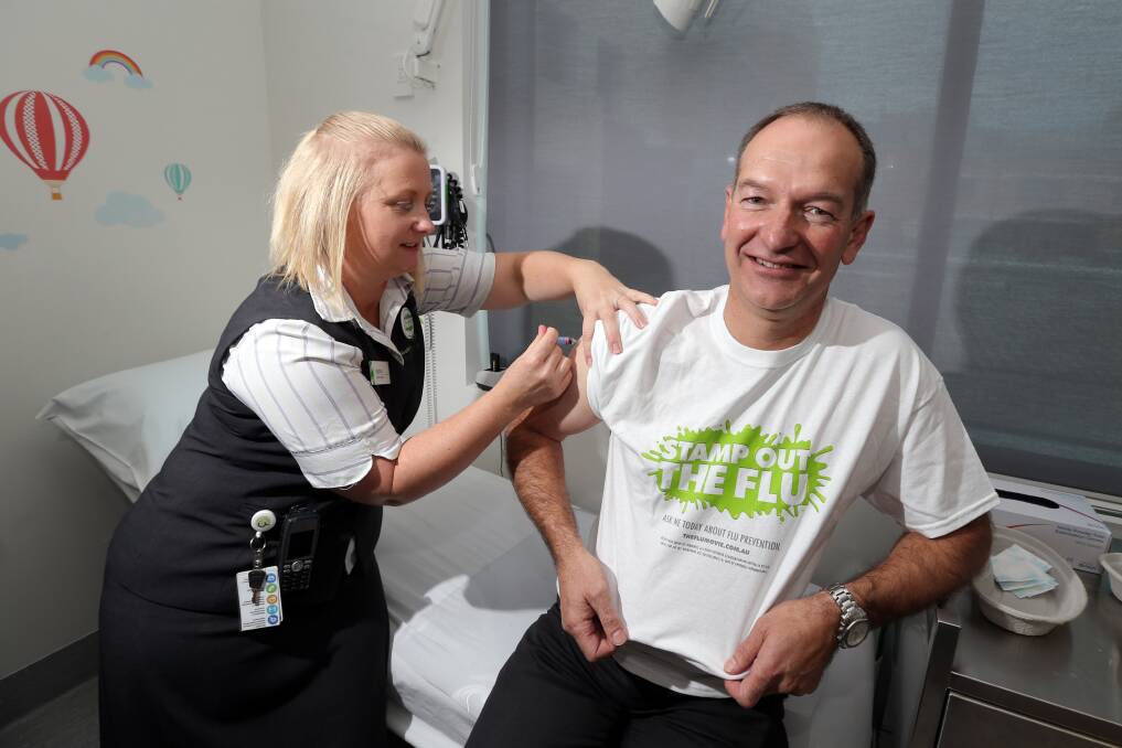 South West Medical Centre practice nurse Katrina Hoye gives South West Healthcare acting CEO Andrew Trigg his flu vaccination. 150421DW01 Picture: DAMIAN WHITE