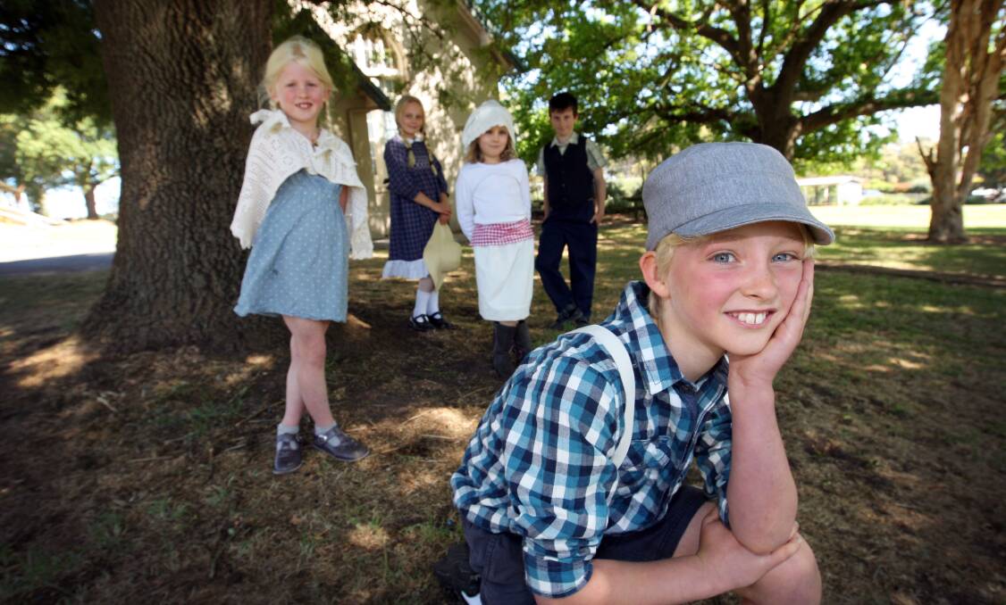 Pupils Lucy Dodson, 6 (left), Sophie Lenehan, 11, Mairead Hewson, 5, Reuben Knoll-Miller, 9, and Harry Dodson, 9 (front), dressed in period costume for the Cudgee celebrations. 141119LP11 Picture: LEANNE PICKETT