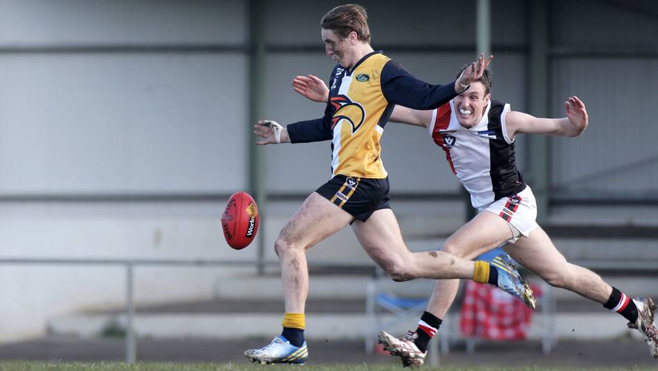 North Warrnambool Eagle Darcy Keast gets away from Koroit's4 Sam Dobson. 140726RG39 Picture: ROB GUNSTONE