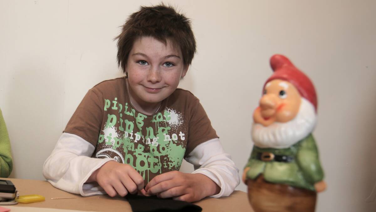 Frank Boyle, 11, of Portland, with Rex the Gnome (a school project) at the Flagstaff Hill holiday program. Picture: ROB GUNSTONE