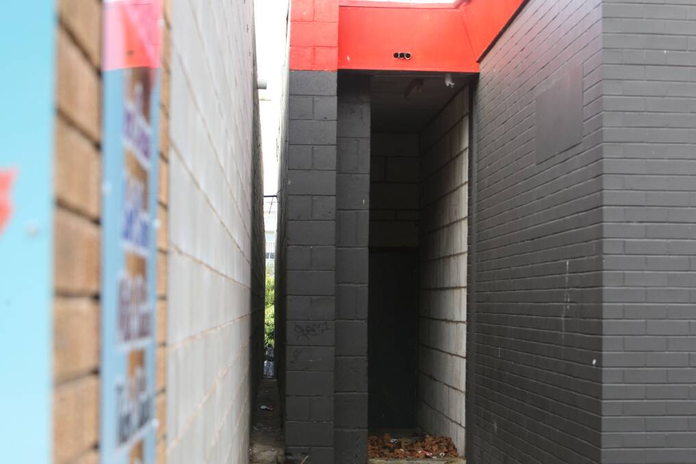 The gap between the bowling alley and ice cream parlour on Timor Street narrows to about 30 centimetres near the rear of the buildings where people jump down into a private off-street carpark.