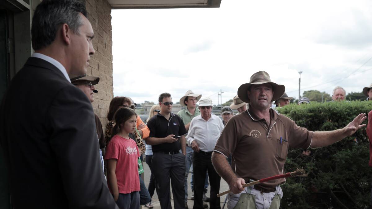 Stock agent Anthony Mahony asks a question of WCC mayor Michael Neoh during a heated meeting at the Warrnambool Saleyards. Picture: ROB GUNSTONE