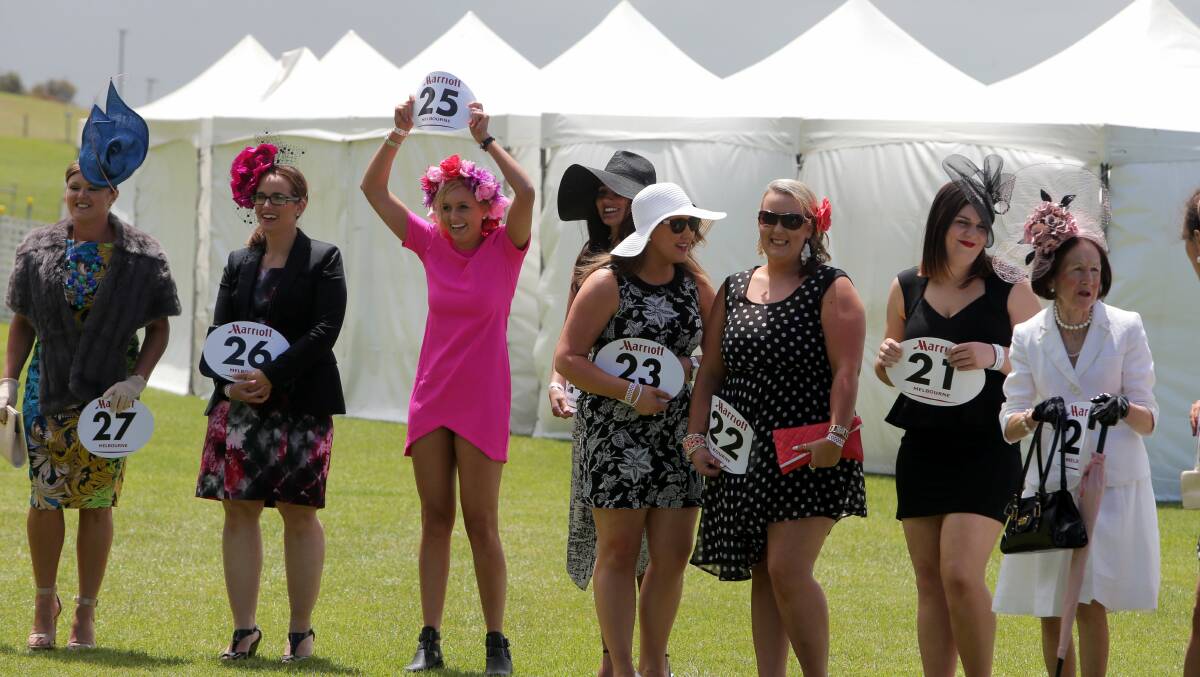 Horse Racing Port Fairy Cup Fashions on the field entrant Caitlin Pickett from Port Fairy holds up her number (25).