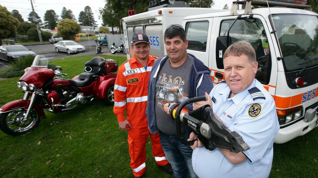 Accident victim Peter Mahony (centre) donated $10,000 to the Port Fairy SES, which was used to buy the combined cutter/spreader received by SES controller Stephen McDowell (right) and SES member Nicholas Seekamp.