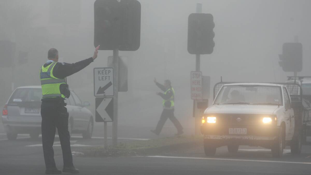 Warrnambool police direct traffic at the Raglan Parade and Kepler Street intersection during a previous winter.