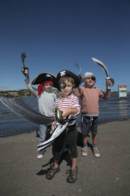 Will Harrison, 4, from Cudgee, Issa Matsuno, 4, from Cudgee, and Jarrah Crabbmor, 5, from Warrnambool dressed to plunder at yesterday's Australian Whaleboat Racing Championships on the Hopkins River.