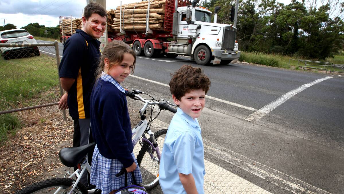 St John's Lutheran Primary School principal Mick Emmett and students Tenille Gollasch, 11, and Jesse Houf, 6, in January at the site of the now almost-completed Portland Ring Road bypass.