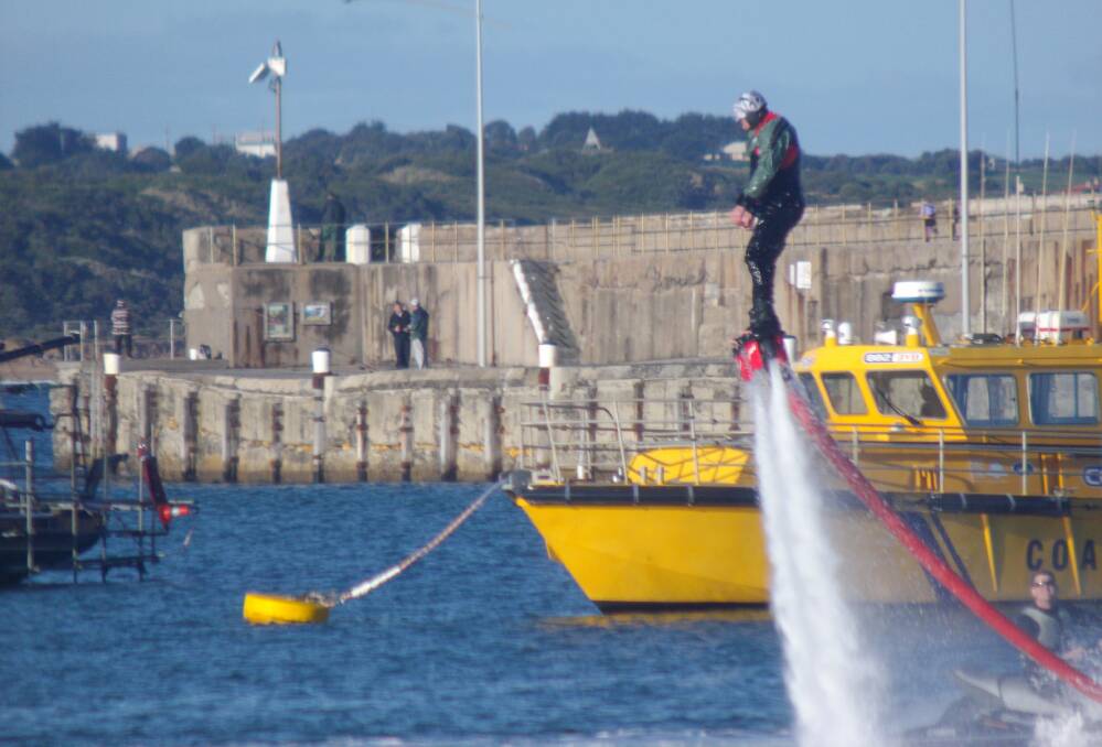 Luke Parsons using his Flyboard at the breakwater. Picture: Janice Trenair