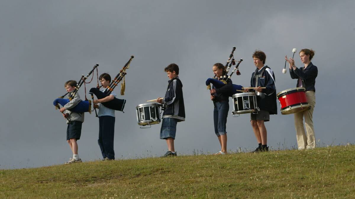 Members of the Warrnambool junior pipe band practicing before the titles.